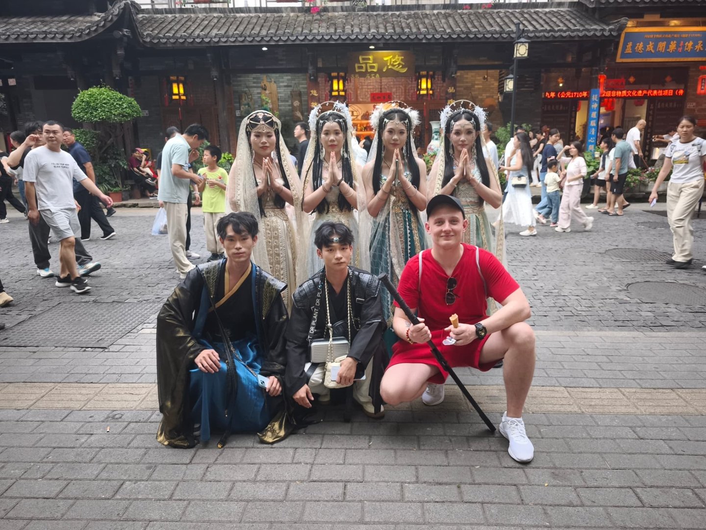 Trislavica traveller with people wearing traditional Chinese clothing