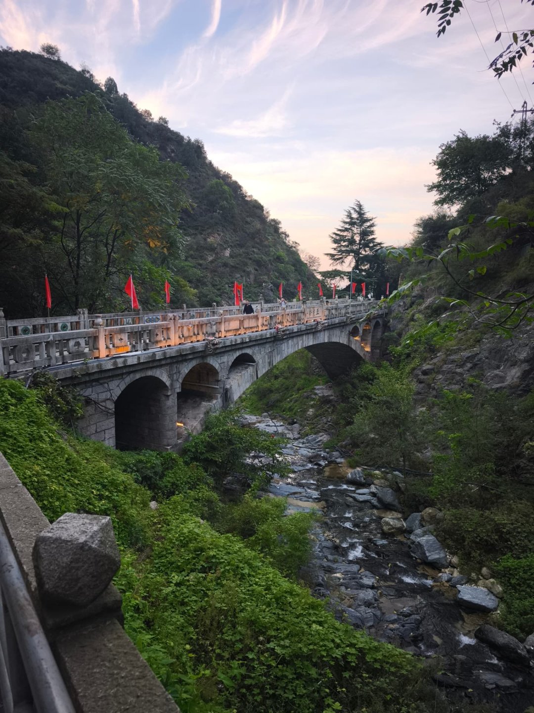 Stone bridge with red flags in the Huashan region